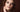 Close-up portrait of a model wearing a dark, smudged smoky eye — the pirate eye makeup look